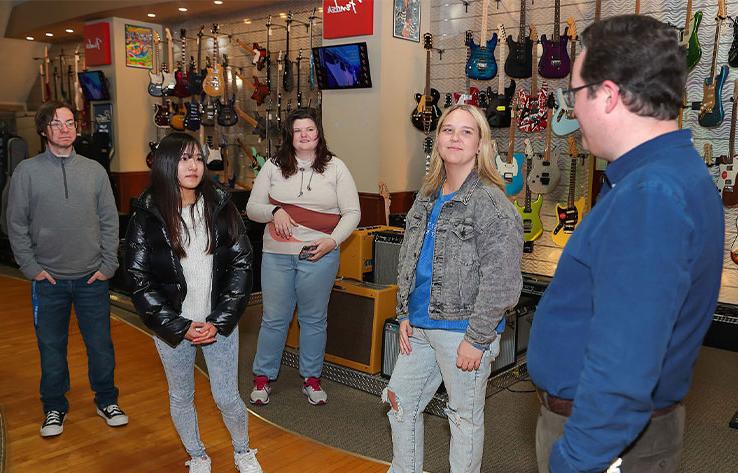 students tour a music store